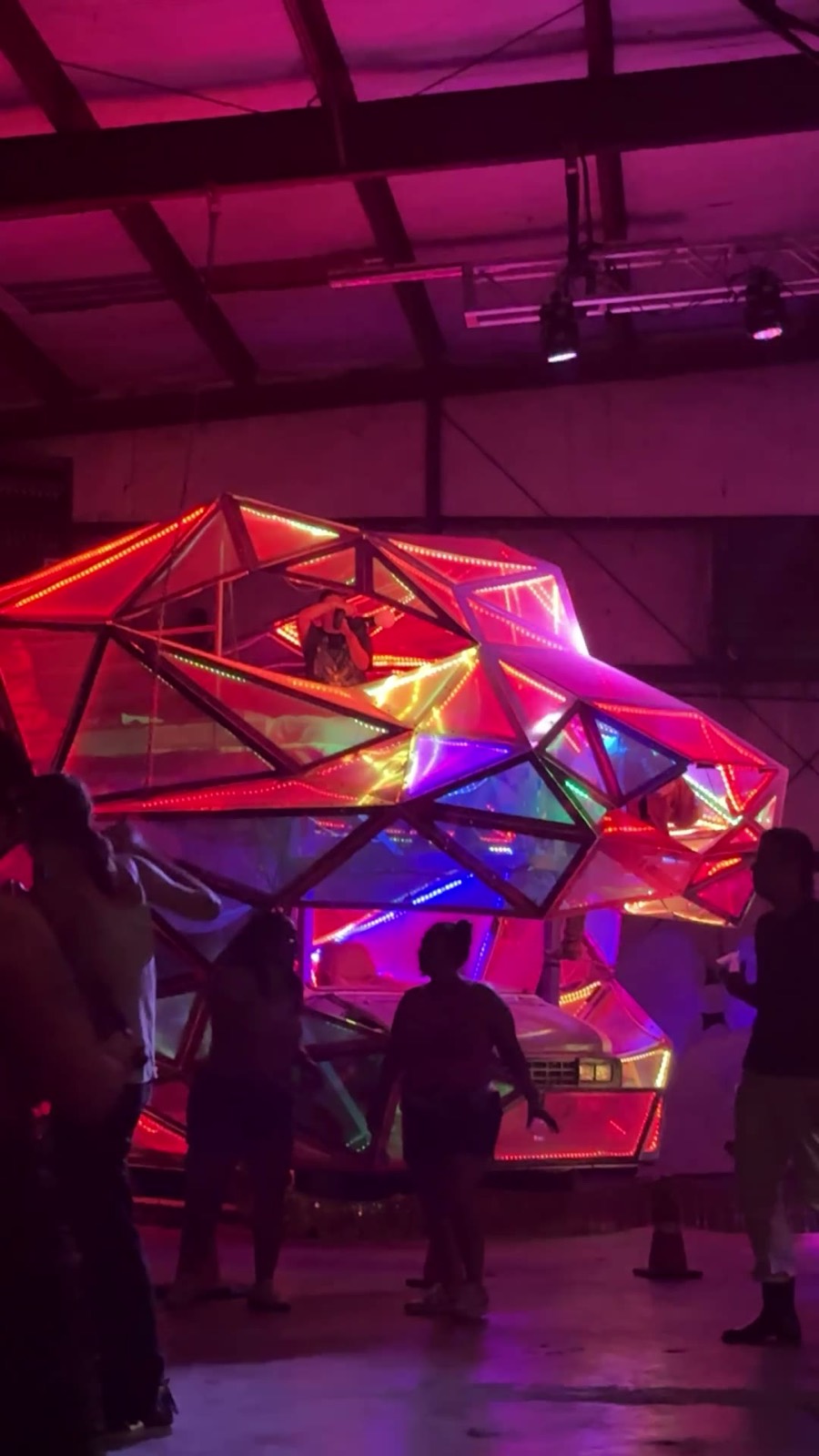 Babestock Rave — the crowd around the neon light sculpture