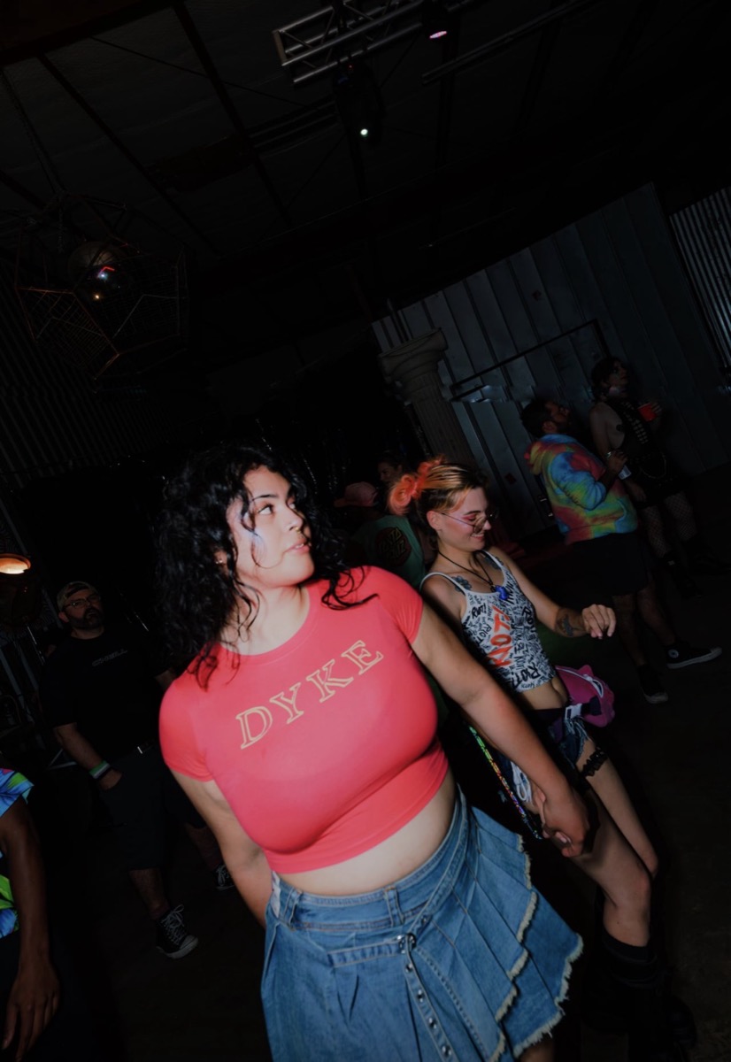 Dancers moving under the disco ball