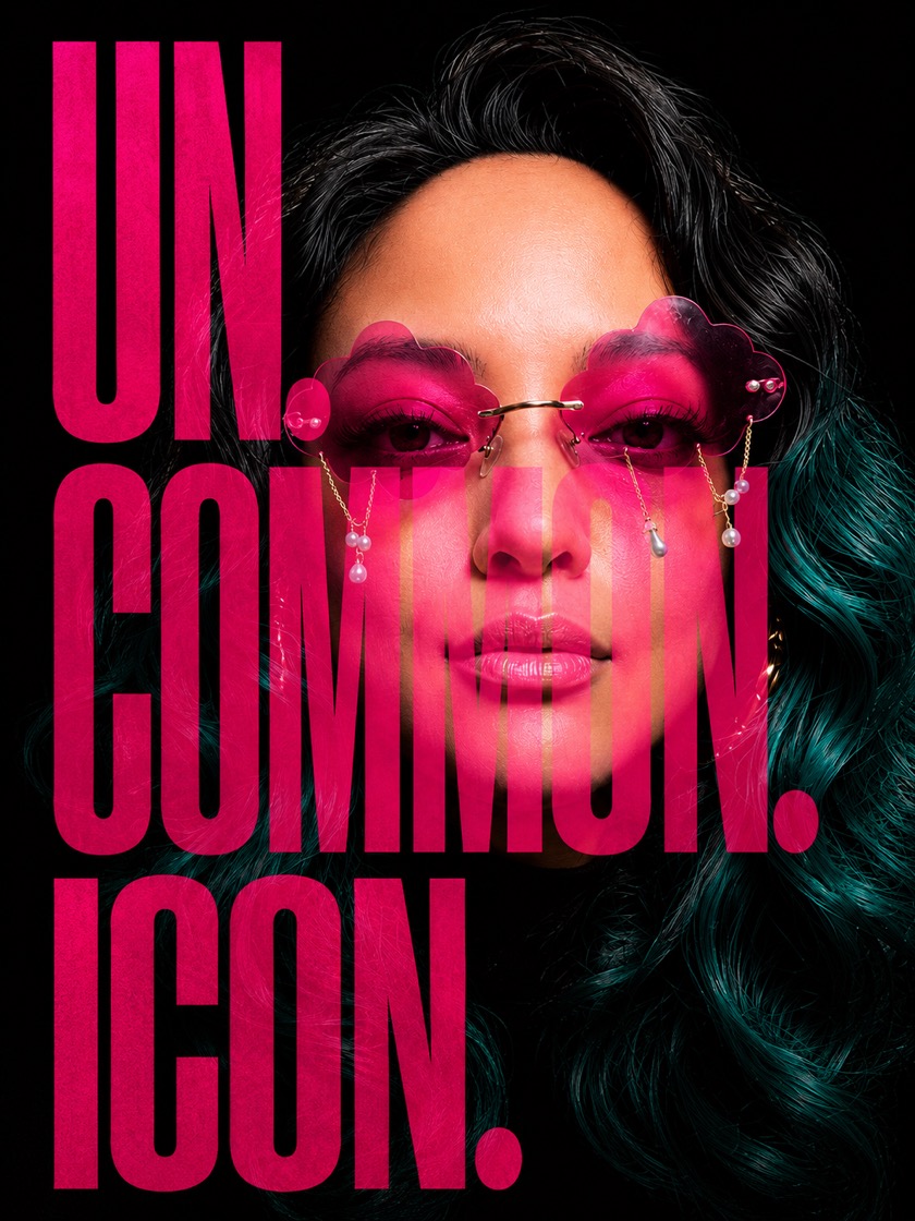 Campaign poster · the UN.COMMON.ICON wordmark in pink over Sasha's face